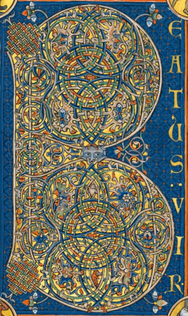 The letter B in a medieval manuscript, intricately designed with coiling lines and woven patterns with plants and animals; the letters E A T U S (forming the word beatus) and V I R (vir) are written vertically beside it.